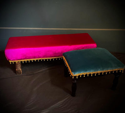 Moroccan style low seating for hire. Set of Fuchsia pink low bench and Turquoise low stool. Furniture hire for Moroccan themed parties Essex by Rock the Day