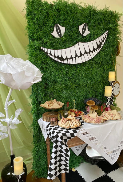 Transform any event into a madcap adventure with our Cheshire Cat backdrop! Themed events prop hire London | Bespoke parties by Rock the Day | Prop hire Essex