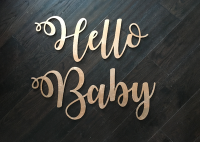 Laser cut "Hello Baby" sign, hand gilded in gold or copper. Event hire, photoshoot props