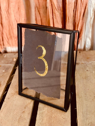 Black frame table number stand for hire as a perfect addition to your table decor. Table decor hire Essex by Rock the Day - wedding and event styling London 