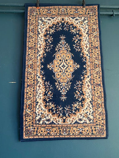 Navy blue/ beige rug for hire. Small rug for hire. Party hire