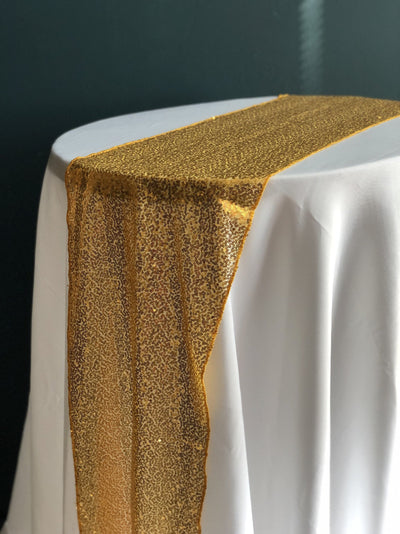 Gold Sequinned Table Runner. Looks really elegant on white table cloth. Essex wedding hire. Rock The Day