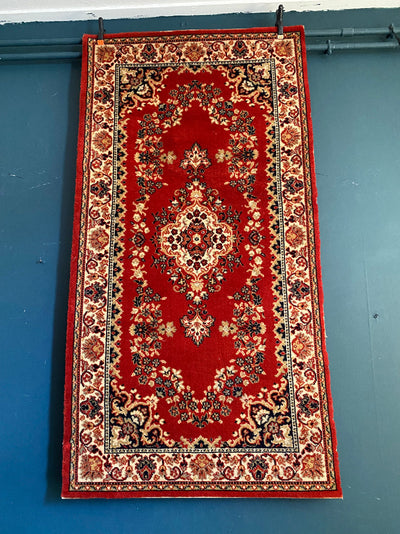 Red vintage rug for hire. Rock The Day event hire | wedding decor hire